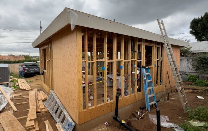 Detached accessory dwelling unit in progress, completed rough framing and rough electrical