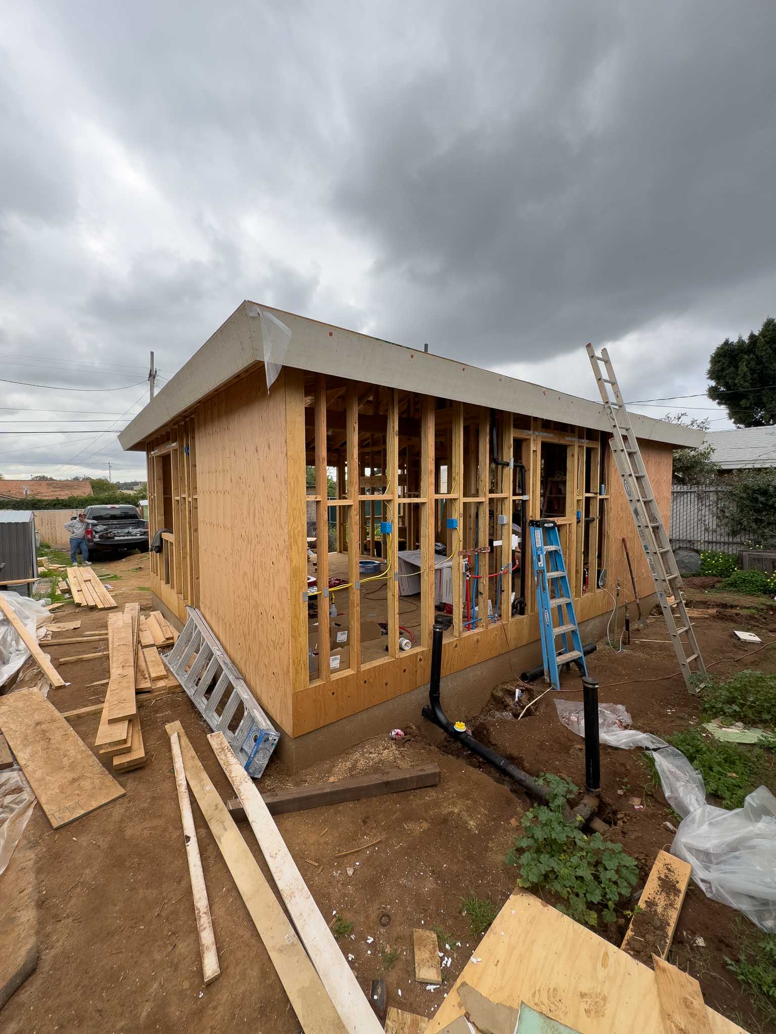 Detached accessory dwelling unit in progress, completed rough framing and rough electrical