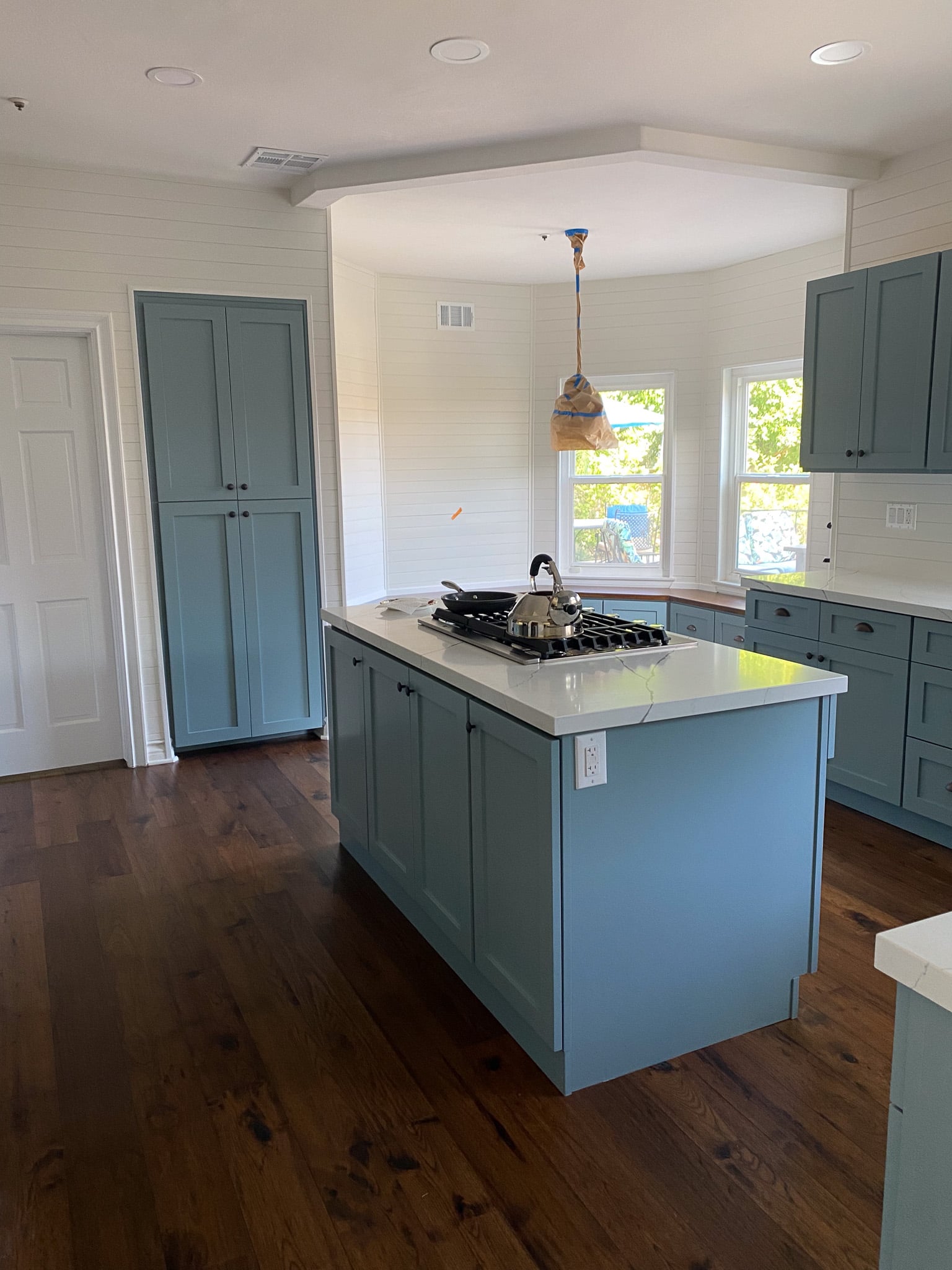 kitchen island with cooktop and downdraft vent