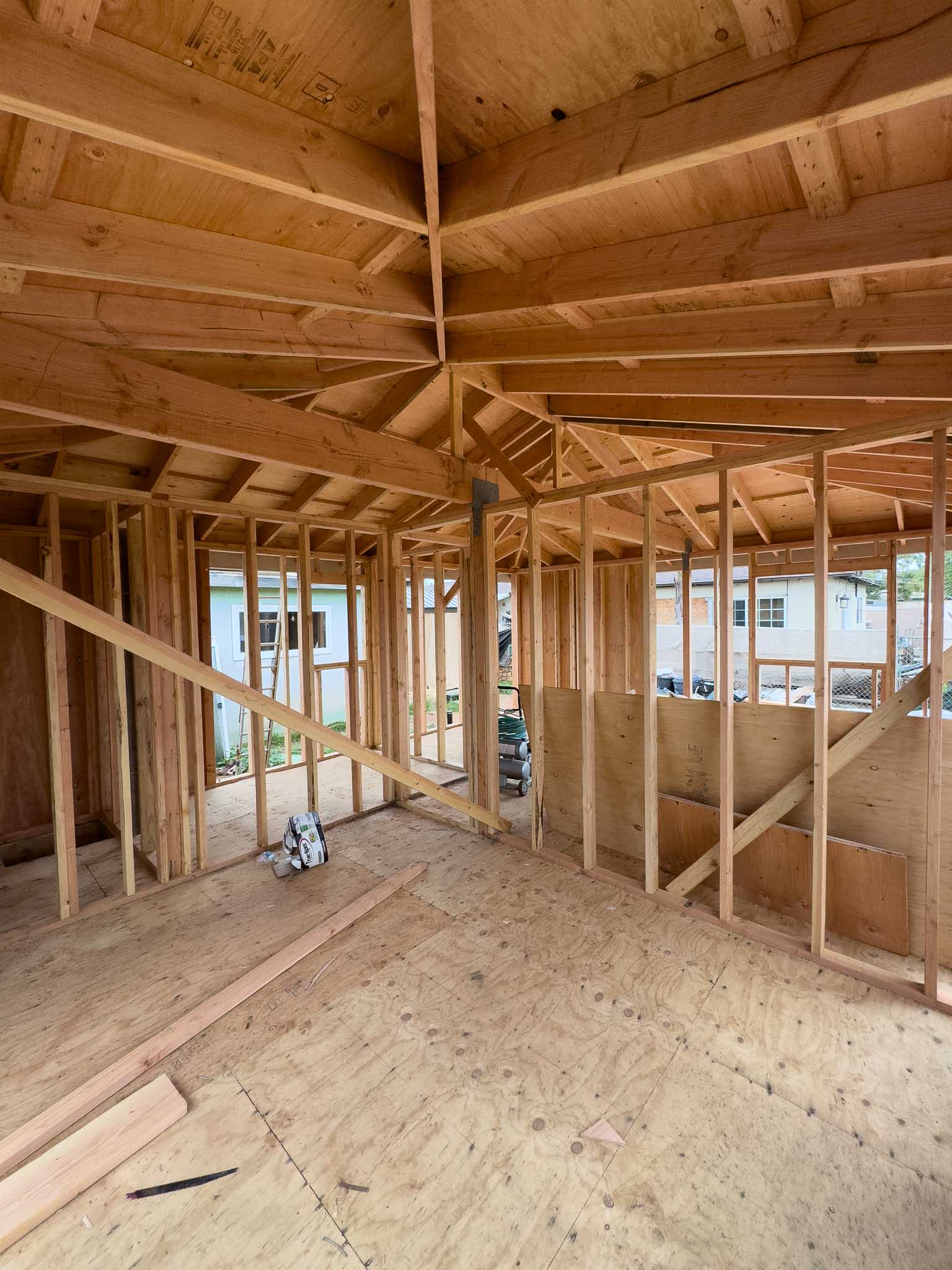 framing of a 500 square feet detached ADU in Chula Vista for a single family home, performed by a general renovation contractor. The ADU is featured vaulted ceilings.